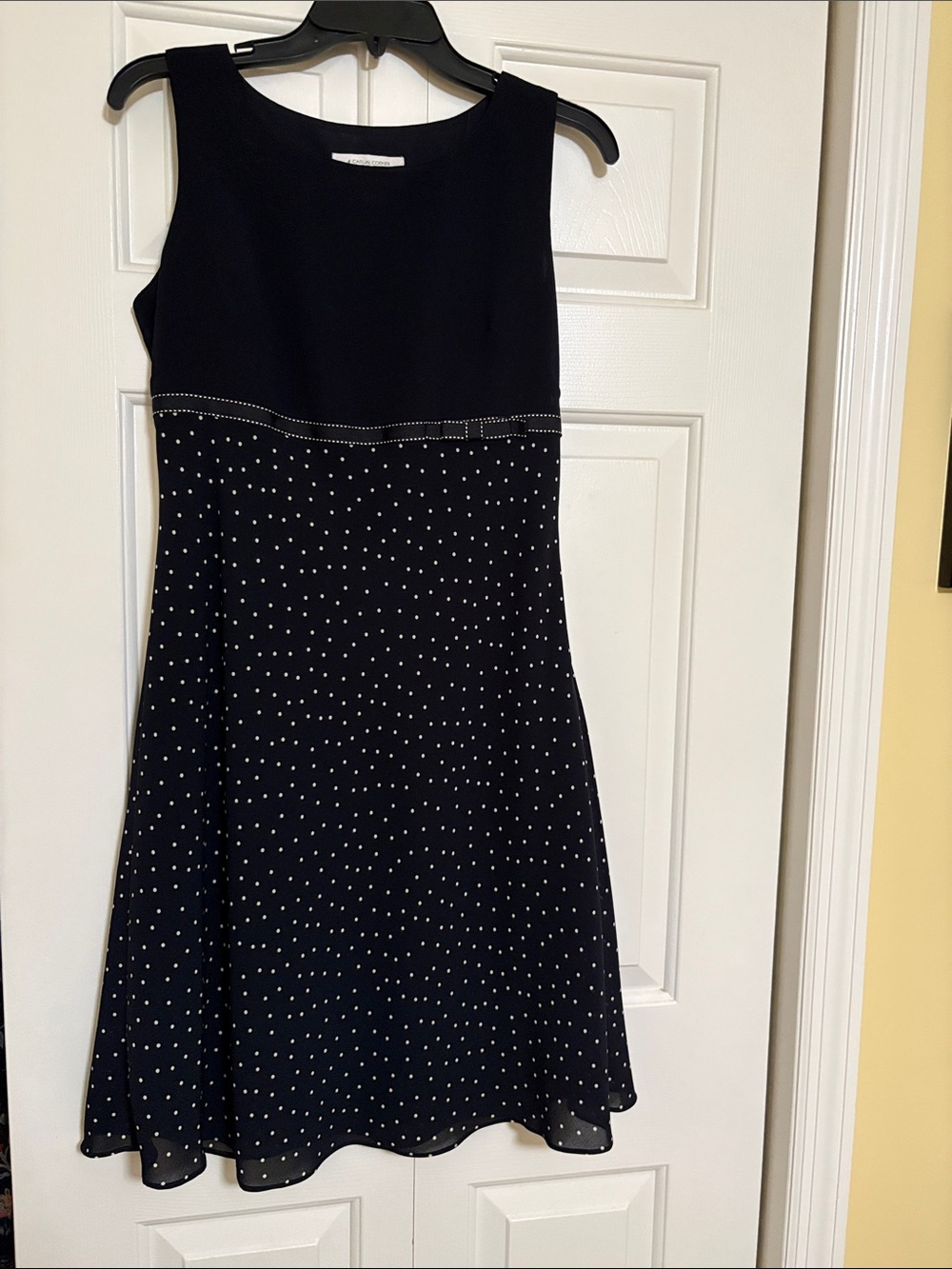 Casual Corner Annex Petite ivory label on black fabric